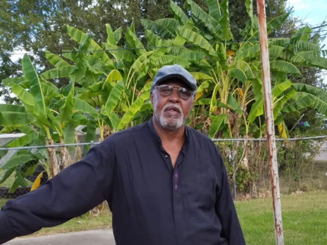 Man in a cap standing in his yard, a Roofing 911 Program family